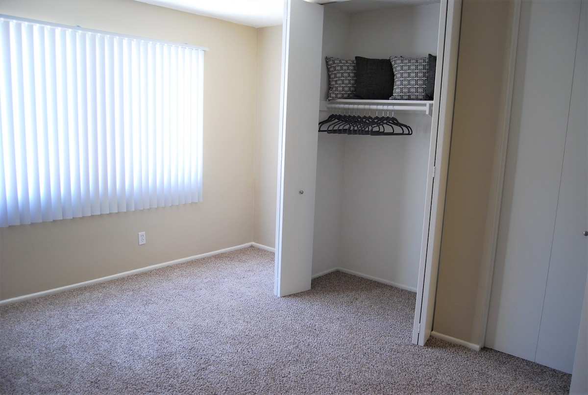 Bedroom with plush carpeting. Large walk-in closets in the bedroom.