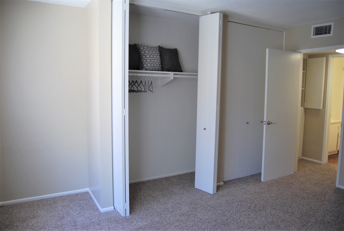 Bedroom with plush carpeting. Large walk-in closets in the bedroom.